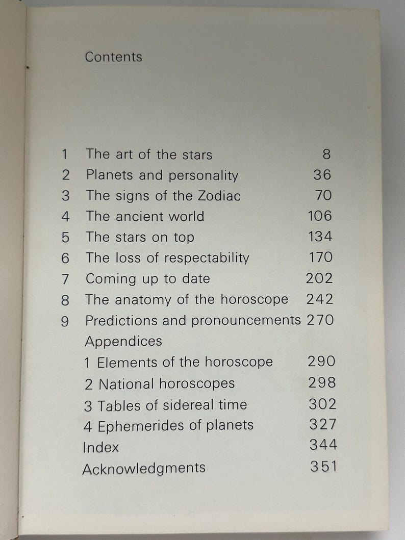 May include: Open book page with a list of contents. The title "Contents" is at the top. The list includes topics like "The art of the stars", "Planets and personality", and "The signs of the Zodiac". Page numbers are listed next to each topic.