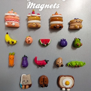 May include: A selection of Jellycat fridge magnets featuring food-themed designs. The magnets depict cakes, fruits, and vegetables in vibrant colours. The words "Jellycat Fridge Magnets" are written at the top.