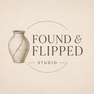 May include: A logo design with a sketched illustration of a cracked vase. The text "FOUND & FLIPPED STUDIO" is in a serif font, within a partial circle and a line. The colour scheme is neutral, with a beige background and brown text and illustration.