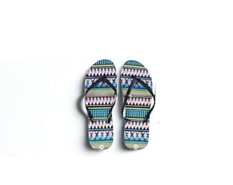 Black tribal designed flip flops