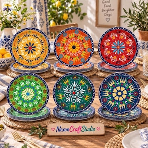 May include: A set of six round ceramic plates featuring vibrant, multi-colored floral and geometric patterns in yellow, orange, red, green, teal, and blue. Each plate has a dark blue scalloped rim. A wooden sign reads NexonCraftStudio.