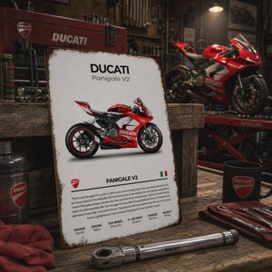 May include: A rectangular metal sign featuring a red and white Ducati Panigale V2 motorcycle illustration, the Ducati logo, and technical specifications including 155 HP, 955cc engine, 270 km/h top speed, 3.2 seconds 0-100 km/h, 104 Nm torque, and 197 kg weight.