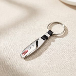 German Engineering Luxury Keychain – Sleek Black Finish | Premium Automotive Accessory | Four Rings Style