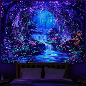 May include: A vibrant tapestry depicting a glowing forest scene with a waterfall. The artwork features lush foliage, pink flowers, and a flowing river, all illuminated with neon blue and purple hues. The tapestry is displayed above a bed with white pillows.