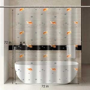 May include: A semi-transparent shower curtain featuring a repeating pattern of orange goldfish and small grey pebbles. The curtain measures 72 inches in height and 72 inches in width, hanging from a metal rod with rings above a white oval bathtub.