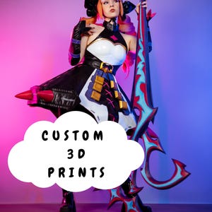 May include: A person in a cosplay outfit with a black and white dress, holding a large, ornate weapon. The outfit includes a black and gold belt, gloves, and a headpiece with cat ears. The text "CUSTOM 3D PRINTS" is in a white cloud.