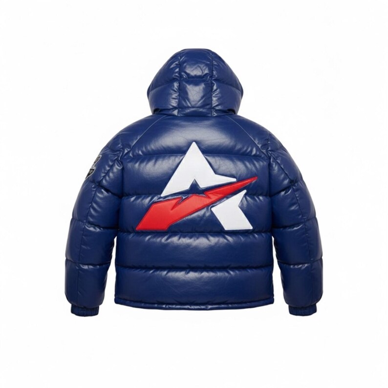 May include: A navy blue puffer jacket with a hood. The back of the jacket features a white and red logo. The jacket has a shiny, quilted appearance. The jacket is designed for cold weather.