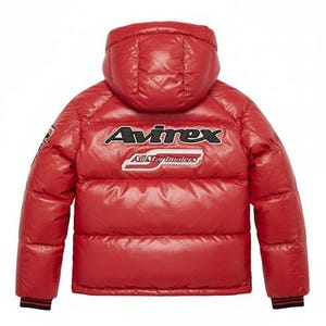 May include: A red puffer jacket with a hood. The jacket features the "Avirex" logo in white and black across the back, with "All Star Dealers" below. The jacket has black and red striped cuffs.