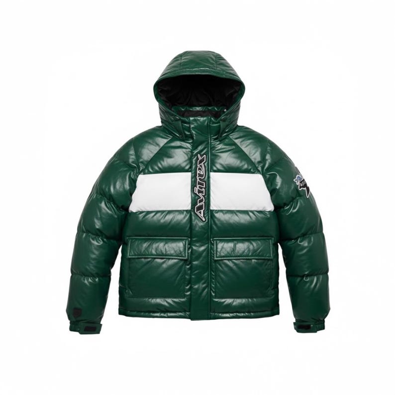 May include: A glossy, dark green puffer jacket with a hood and two front pockets. The jacket has a white stripe across the chest and the word "Avirex" in white. A small patch is on the upper right sleeve.