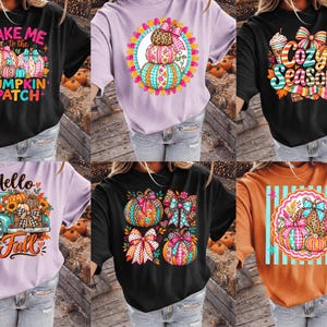 May include: A collection of six short-sleeved t-shirts in black, light purple, and orange, each featuring colorful graphic prints of pumpkins, bows, trucks, and seasonal text including Take Me to the Pumpkin Patch, Cozy Season, and Hello Fall.