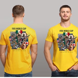 May include: A bright yellow short-sleeve t-shirt featuring a FIFA World Cup 2026 graphic on the chest. The design includes the text FIFA WORLD CUP, the number 2026, a soccer player, a soccer ball, and the flags of the USA, Mexico, and Canada.