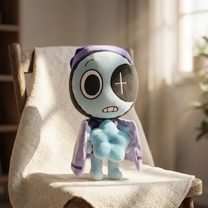 May include: A plush doll with a light blue face, black eye, and a cross stitched on the other eye. It wears a purple nightcap and cape, and holds a blue star. The doll is sitting on a wooden chair.
