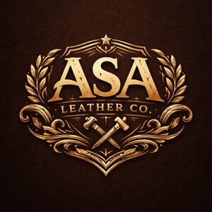 May include: A gold-colored logo on a dark brown background featuring the text ASA LEATHER CO. in a serif font. The design includes a central emblem with two crossed tools, surrounded by ornate filigree, laurel leaf branches, and a small star.