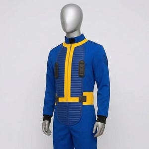 Side profile view of the Fallout Vault Dweller jumpsuit costume, showcasing the clean fit, the continuation of the yellow trim on the collar and waist, and the ribbed black cuff detail on the sleeve