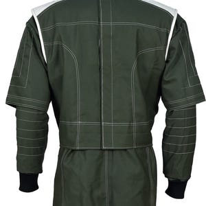 May include: A dark olive green racing suit featuring white contrast stitching throughout. The jacket portion has white shoulder panels, a high collar, and black ribbed cuffs at the wrists. The design includes horizontal quilted detailing on the sleeves.