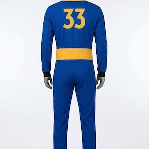 Full back view of the Fallout cosplay Vault Dweller jumpsuit, featuring a large golden-yellow '33' vault number (as seen in the Fallout TV series) on the blue back panel, with rear belt details.