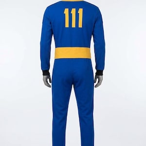 Full back view of the Fallout cosplay Vault Dweller jumpsuit, featuring a large golden-yellow '111' vault number (from Fallout 4) on the blue back panel, along with the rear waist belt.