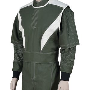 May include: An olive green jumpsuit featuring a high collar, white textured shoulder panels, and white contrast stitching. The sleeves have a geometric quilted pattern on the forearms, short layered sleeves, and black ribbed cuffs at the wrists.