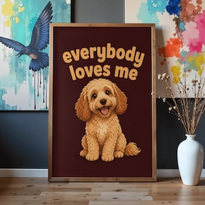 May include: A framed rectangular wall art print featuring a dark brown background with the text "everybody loves me" in a light orange font above a central illustration of a fluffy, light brown puppy with a happy expression and open mouth.