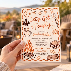 May include: A rectangular invitation card with a wavy orange border featuring illustrations of a campfire, s'mores, a mug, and trees. The text reads: Let's Get Toasty, Join Us For A Bonfire Party, Saturday, November 14, 2026, 5:00 PM - 10:00 PM.