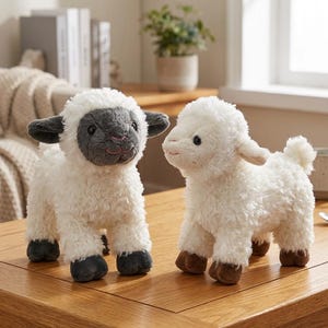 May include: Two plush toy lambs with white, fluffy bodies. One lamb has a gray face, ears, and feet, while the other has a white face and brown feet. They are positioned on a wooden table, creating a charming and cuddly scene.