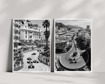 May include: Two black and white photographic prints depicting the Monaco Grand Prix. The left print shows race cars navigating a city street curve near grandstands. The right print displays an aerial view of the harbor and race track circuit.