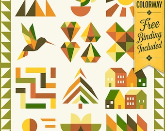 May include: A quilt featuring a grid of geometric shapes in shades of green, yellow, orange, and brown. Patterns include a hummingbird, sun, houses, trees, and abstract forms. A yellow banner on the right reads SHOP EXCLUSIVE COLORWAY Free Binding Included.