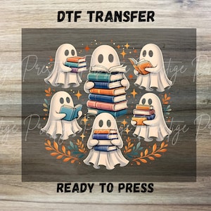 May include: A DTF TRANSFER READY TO PRESS graphic featuring five white ghosts holding stacks of colorful books. The ghosts are arranged in a circle surrounded by orange and teal leaves and small stars. The text DTF TRANSFER and READY TO PRESS is visible.