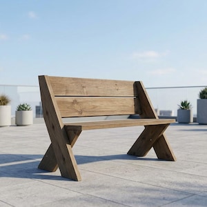 May include: A wooden bench with an X-shaped leg design and a slatted back. The bench is made of light brown wood and is set on a tiled surface with potted plants in the background. The sky is blue.