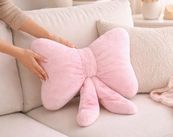 Cojín rosa con lazo, de felpa, coqueta, de piel sintética, decorativo, para sofá, con un toque estético y bonito, ideal para la decoración de habitaciones femeninas.