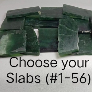 May include: A selection of dark green jade slabs with irregular edges. The slabs are displayed on a white surface. The image includes the text "Choose your Slabs (#1-56)".