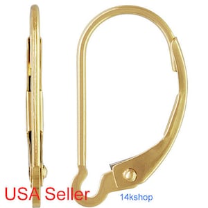 May include: Gold-toned earring back closure. The back is a simple, curved wire with a small hook at the end.