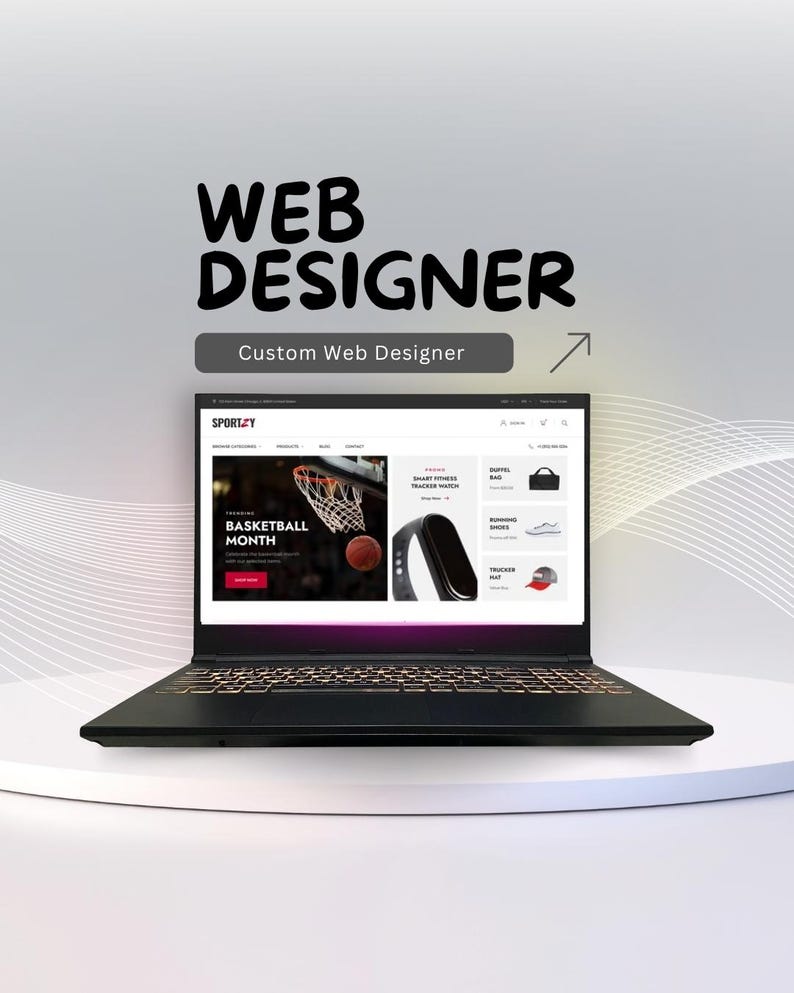 K&ouml;nnte beinhalten: Ein schwarzer Laptop, der ein Webdesign mit dem Text "WEB DESIGNER" und "Custom Web Designer" anzeigt. Die Website zeigt ein Basketball-Thema, einen Smart Fitness Tracker und andere Produkte.