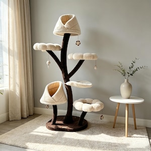 May include: A multi-level cat tree featuring a dark brown trunk-like base and stem with several cream-colored, flower-shaped platforms and two enclosed, petal-shaped sleeping pods. Small hanging toys are attached to the underside of the platforms.