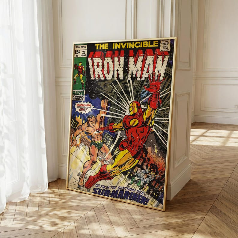 May include: A framed vintage comic book cover featuring Iron Man in a dynamic pose. The artwork is vibrant with red, yellow, and blue hues, showcasing a battle scene with the Submariner. The text "IRON MAN" is prominently displayed.