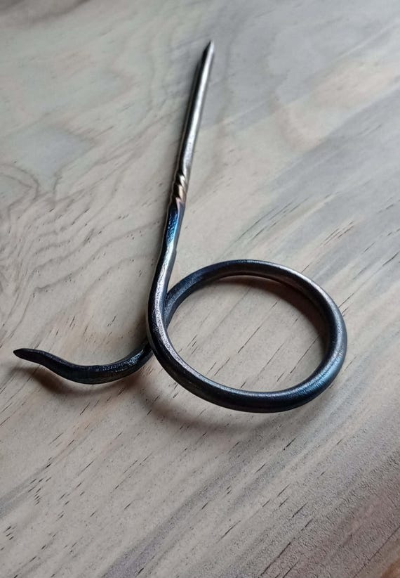 Hand forged, high carbon self defense hairpin, rustic steel confidence accessory.