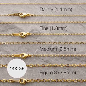 May include: Four gold-toned 14K GF chains with lobster claw clasps, labeled by width: Dainty (1.1mm), Fine (1.8mm), Medium (2.5mm), and Figure 8 (2.8mm). Each chain features distinct link styles and metal finishes.