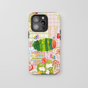 May include: A smartphone case featuring a colourful collage design with a green caterpillar, pink snails, white rabbits, butterflies, flowers, and fruit illustrations set against a background of various pastel-coloured plaid and checkered patterns.