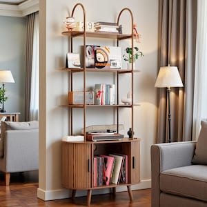 May include: A wooden bookshelf with multiple shelves and a cabinet. The shelves display books, decorative items, and a record player. The cabinet doors have vertical grooves. The frame is a dark brown color.