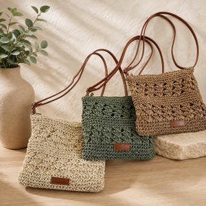 May include: Three square crossbody bags in beige, olive green, and tan, each featuring an open-weave crochet pattern, a solid interior lining, a thin brown shoulder strap, and a small rectangular brown leather-like patch on the front lower edge.