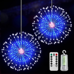 May include: Two spherical firework-style LED string lights emitting a bright blue glow with white tips, suspended by thin wires. A white remote control with numbered buttons and a cylindrical battery pack with a hanging hook are included in the set.