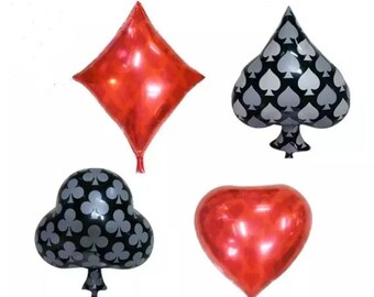May include: Four foil balloons shaped like playing card suits: diamonds, spades, clubs, and hearts. The diamonds and hearts are red, and the spades and clubs are black with a silver pattern.