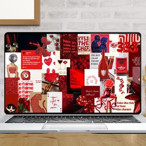 May include: A laptop displays a collage of red images, including text, hearts, and illustrations. The laptop sits on a wooden desk with books, a small plant, and a wooden artist's figure. The screen features the text "KISS THE CHEF" and "je t'aime".