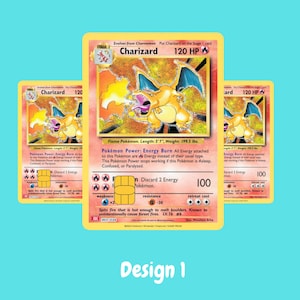 May include: Three Charizard trading cards featuring a gold-colored chip embedded on the surface. The cards display the character Charizard, 120 HP, and text including Pok&eacute;mon Power: Energy Burn. The word Design 1 is printed in white at the bottom.