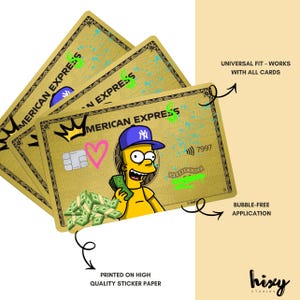 May include: Gold-colored sticker featuring a cartoon character with a blue cap and money, designed to look like an American Express card. The sticker has the words "American Express" and "Universal Fit - Works with all cards" printed on it.