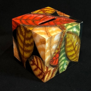 AUTUMN LEAVES PIGGYBANK: A Small Bank Covered With Painted Leaves