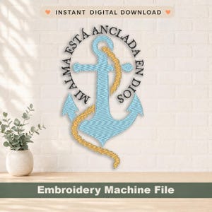 May include: An embroidery machine file design featuring a light blue anchor wrapped in a golden yellow rope. The text MI ALMA ESTA ANCLADA EN DIOS is embroidered in black thread in a circular pattern around the anchor on a white background.