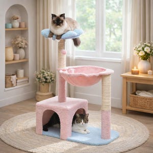 May include: A pink and blue cat tree with multiple levels. A cat rests on a cloud-shaped perch at the top, while two other cats are in the lower levels. The tree has a scratching post and a bowl-shaped bed.