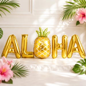 May include: A set of gold foil balloons spelling out the word ALOHA, with a metallic gold pineapple balloon replacing the letter O. The balloons have a reflective surface and are arranged in a horizontal line against a plain white background.