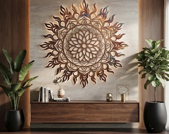 May include: A large, circular, brown wooden wall art piece featuring an intricate, symmetrical mandala pattern with flame-like outer edges. The artwork is backlit, casting a soft glow against the wall, and is mounted above a long, horizontal wooden console.